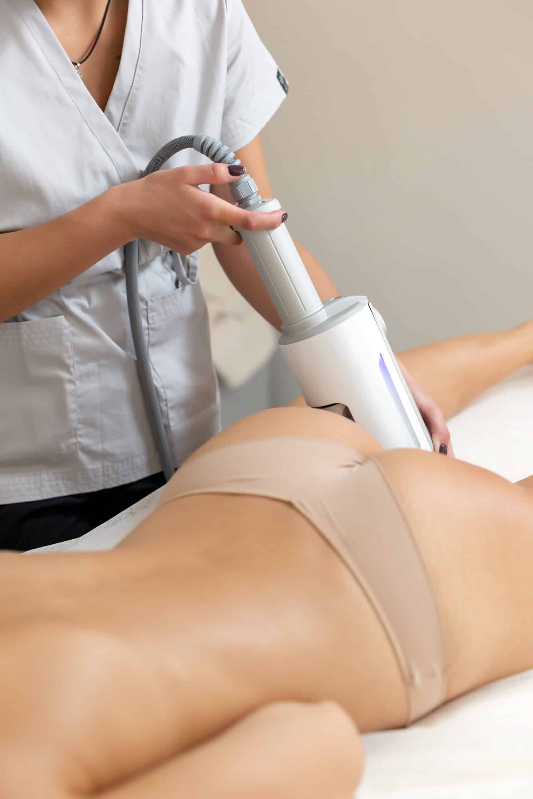 cosmetologist reduce cellulite by endospheres apparatus from females body