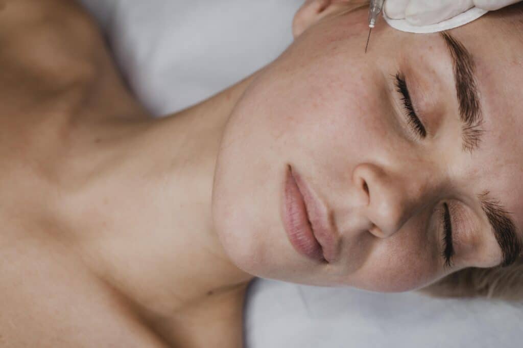 high angle woman getting beauty injection